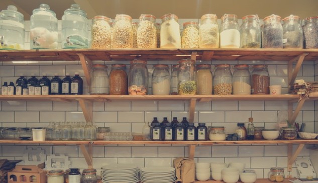 Ceramic jars on pantry shelf