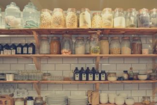 Ceramic jars on pantry shelf