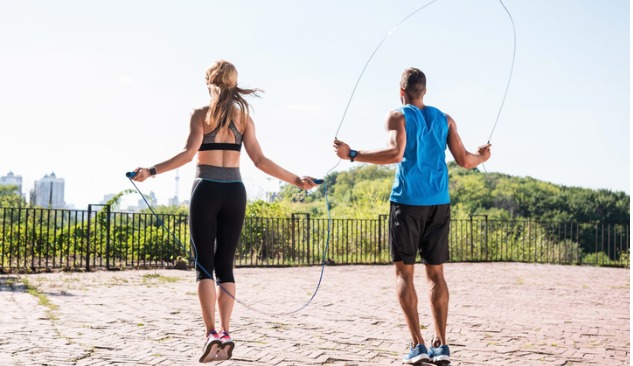 A man and woman skipping rope as a form of anaerobic exercise