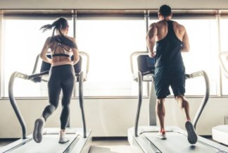 man and woman on a treadmill