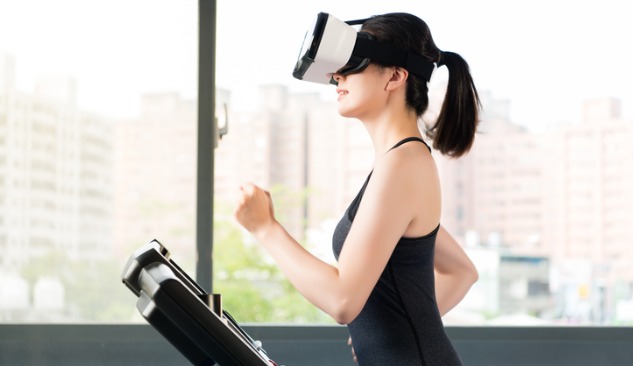 Woman on treadmill with a VR headset